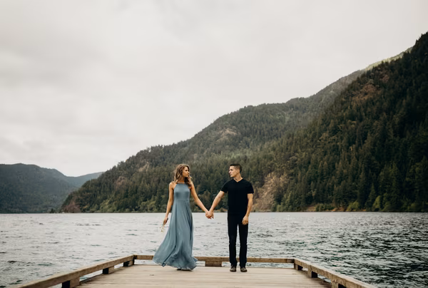 Couple holding hands on a dock
