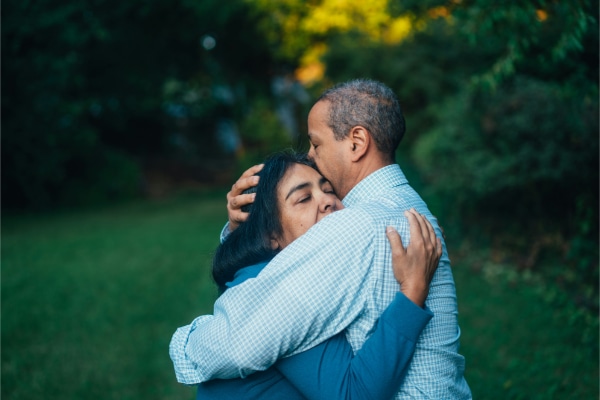 Middle-aged couple hugging each other